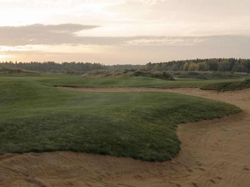 Golf course fairway at sunset
