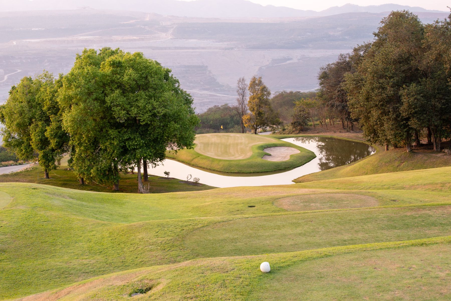 Golf course with fairway and water feature